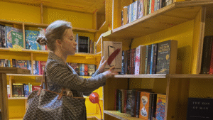 Writer Julia Zolotova with her book The Influencer's Canvas